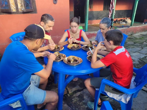 Clients Eating Local Food In Kaulepani